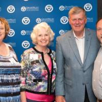 tom and a couple at photo booth